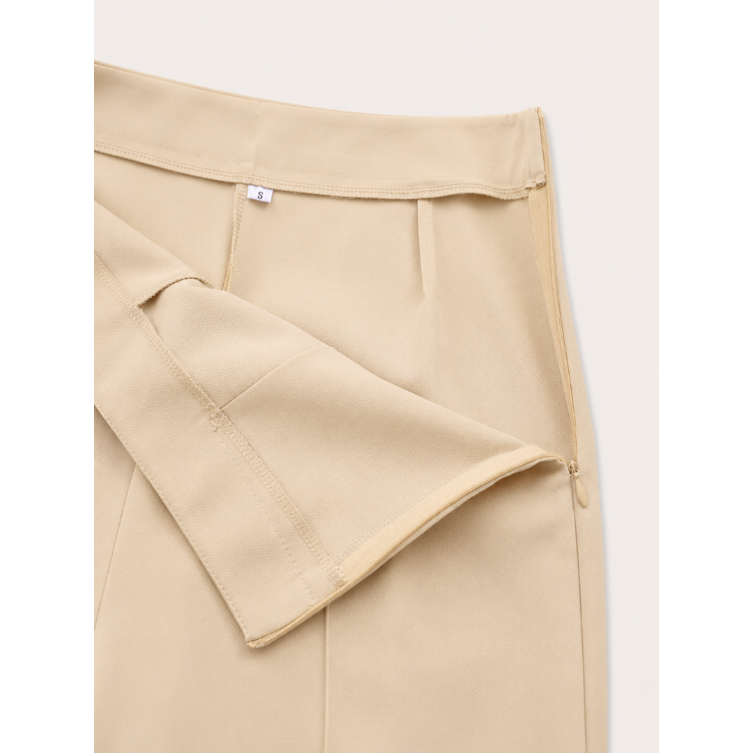 Close-up of the beige wide-leg trousers