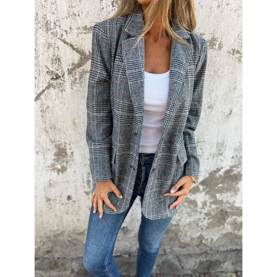 Woman wearing an open grey check blazer