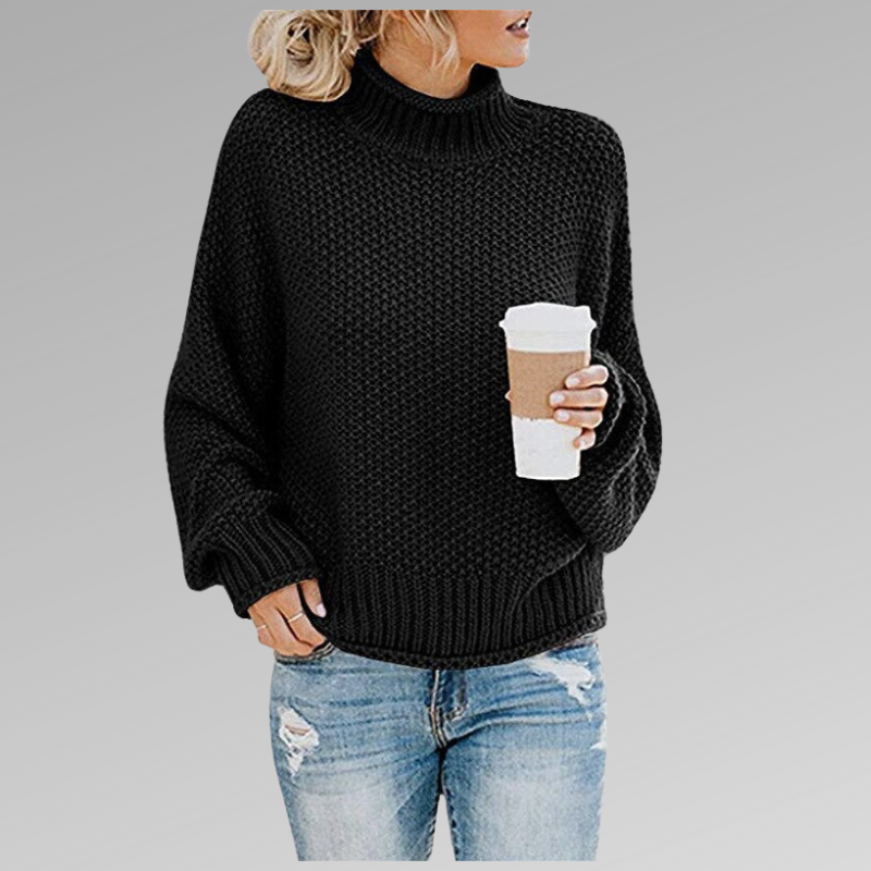 Women's chunky knit turtleneck sweater with relaxed fit in black