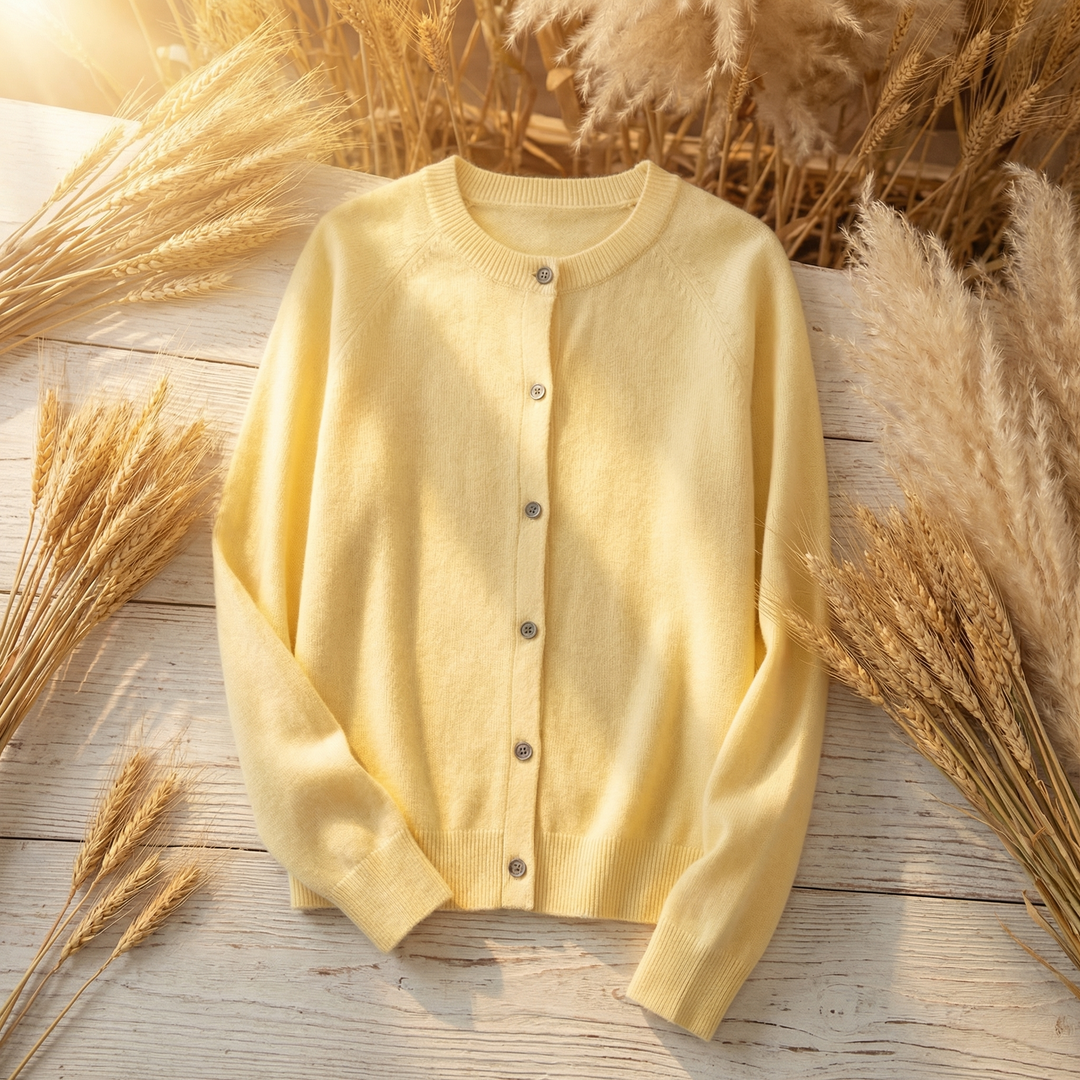 Women's yellow round neck cardigan laid flat