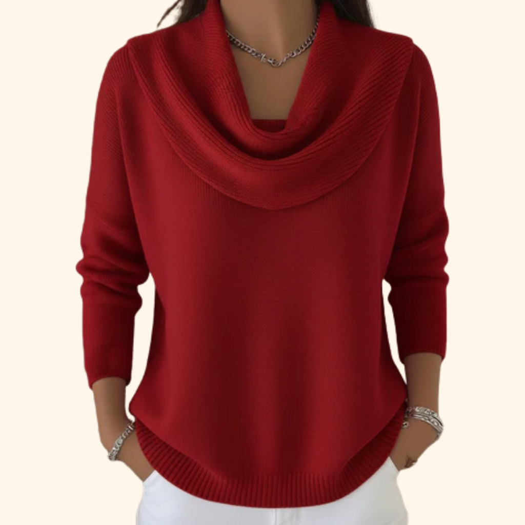 Woman wearing a red cowl neck knit sweater