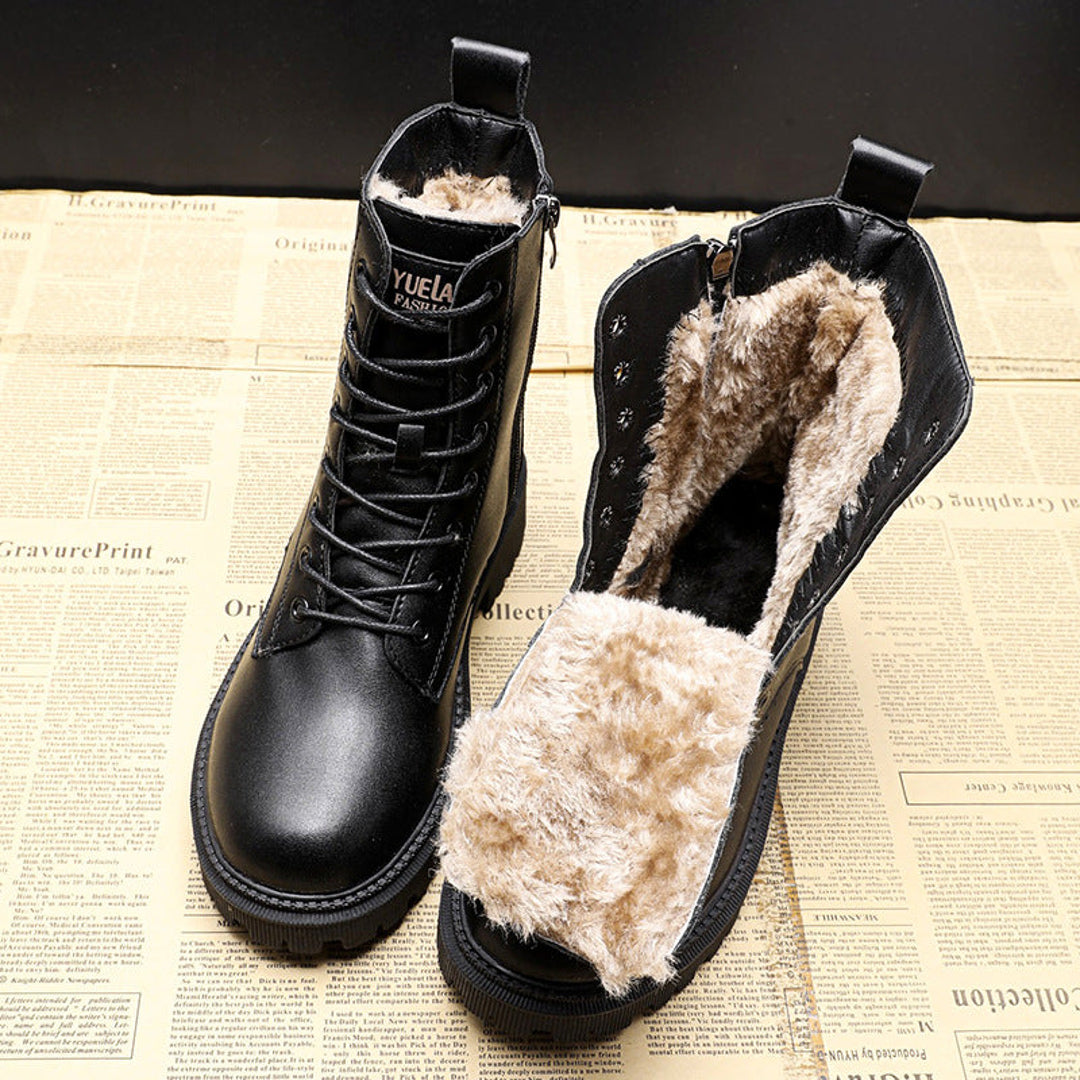 Black lace-up winter boots showing the warm lining
