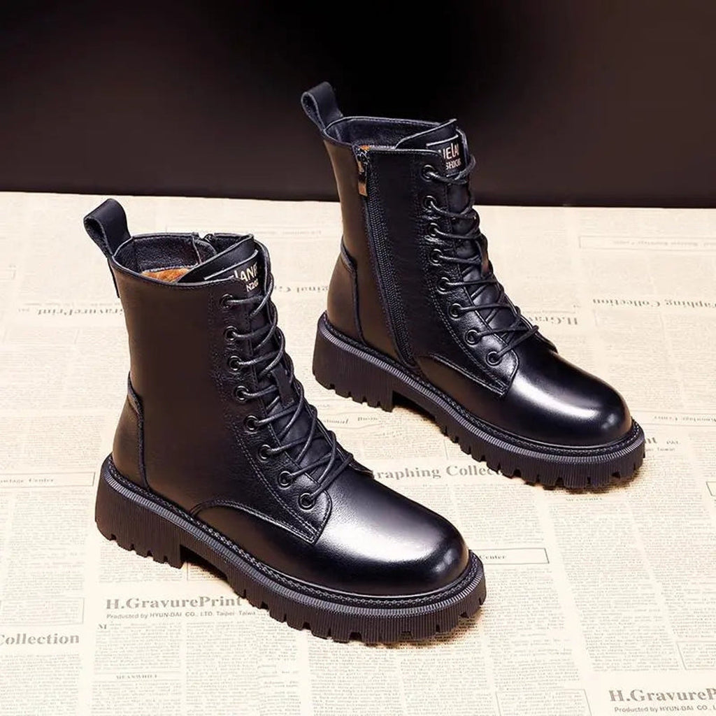 Black and dark brown lace-up winter boots side by side