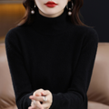 Woman wearing a black fine knit turtleneck
