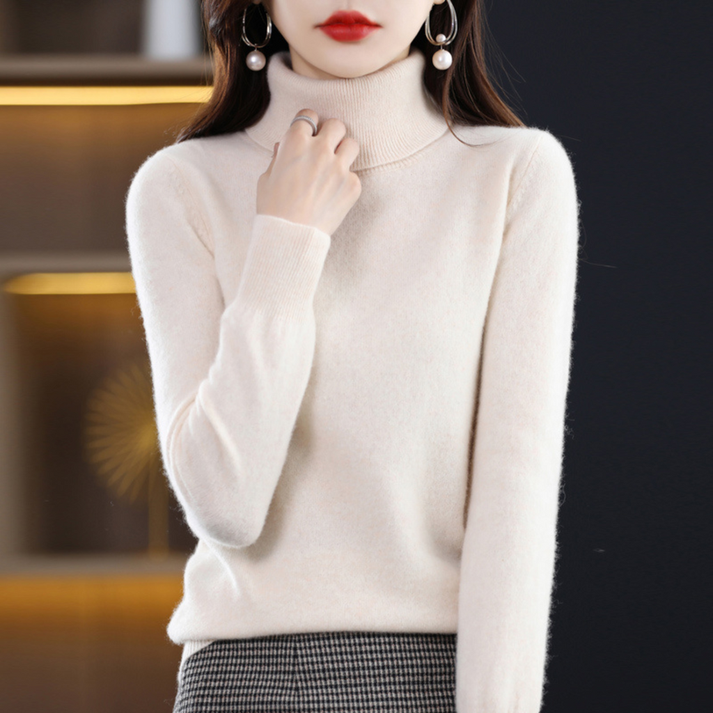 Woman wearing a cream turtleneck sweater