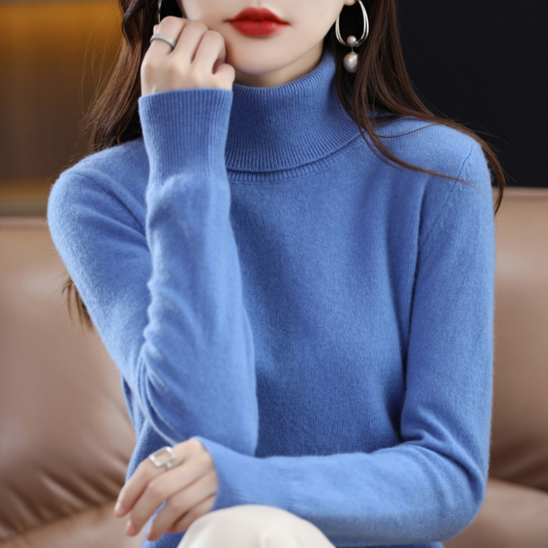 Woman wearing a blue turtleneck sweater