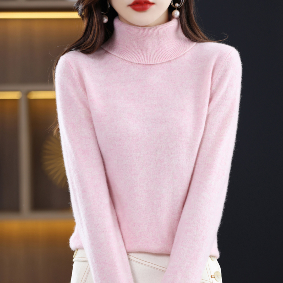 Woman wearing a light pink fine knit turtleneck