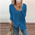 Woman wearing a blue fine knit V-neck cardigan