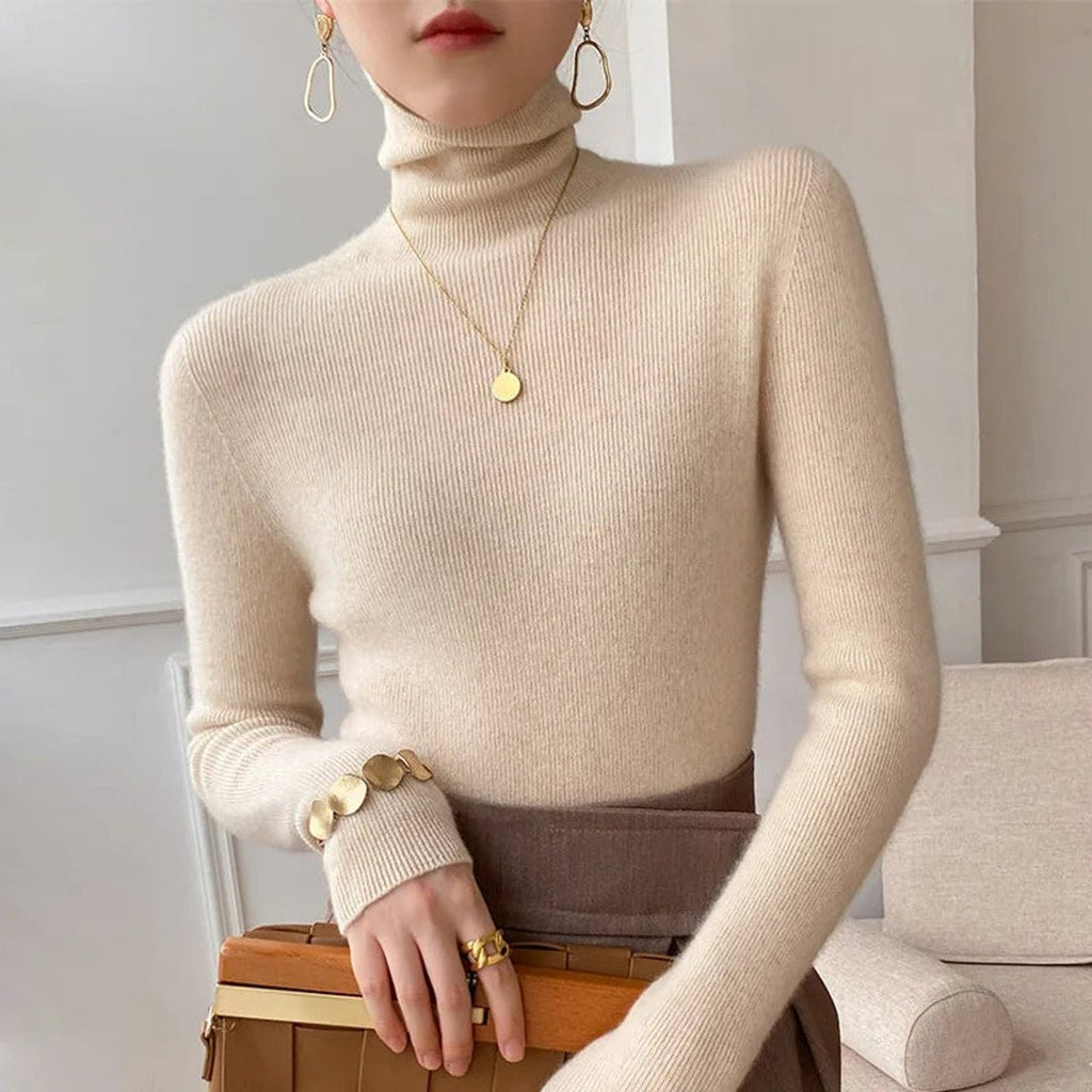 Woman wearing an ivory fitted turtleneck sweater