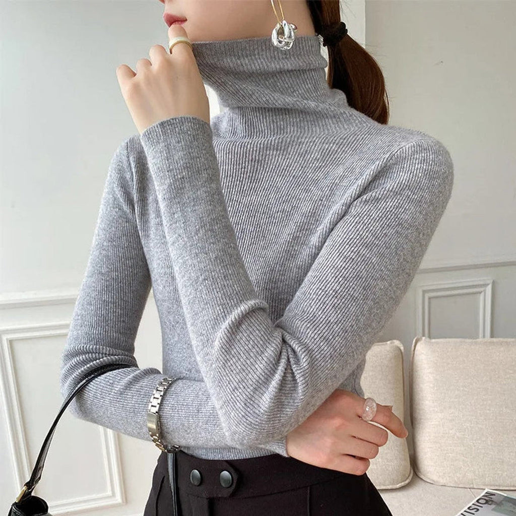 Woman wearing a grey fitted turtleneck