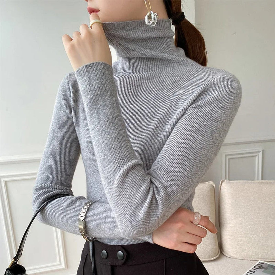 Woman wearing a grey fitted turtleneck
