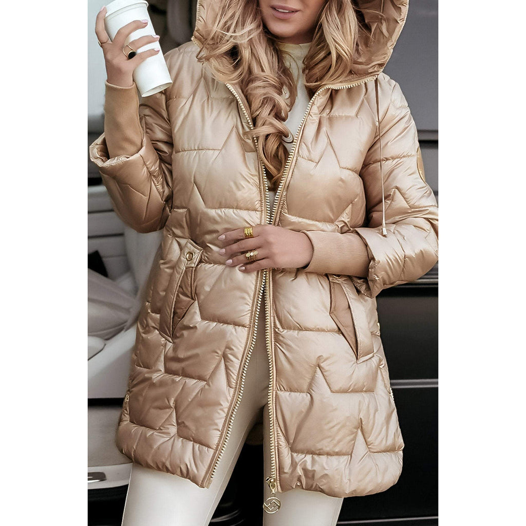 Woman wearing a beige quilted jacket – front view
