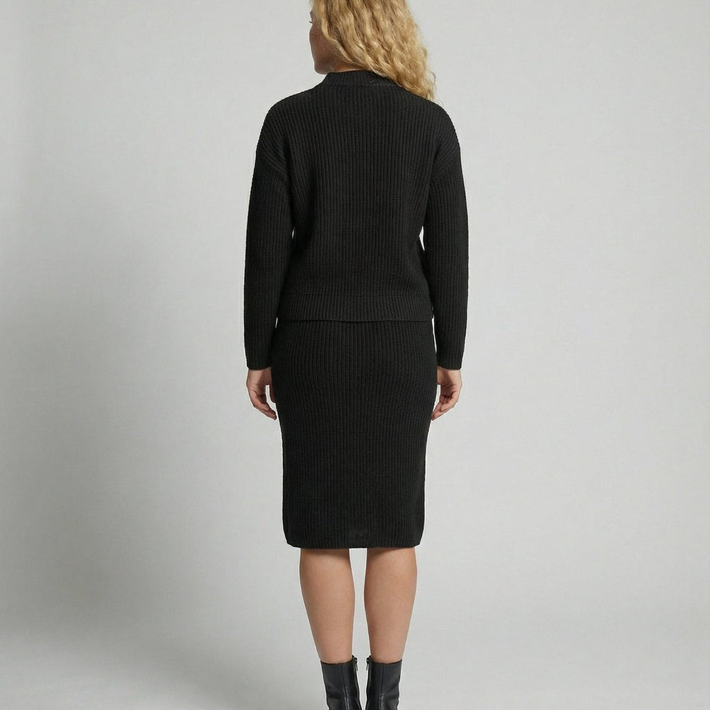 Women's knit set with mock neck sweater and midi skirt in black, back view