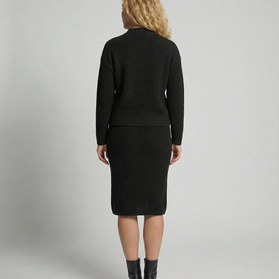 Women's knit set with mock neck sweater and midi skirt in black, back view
