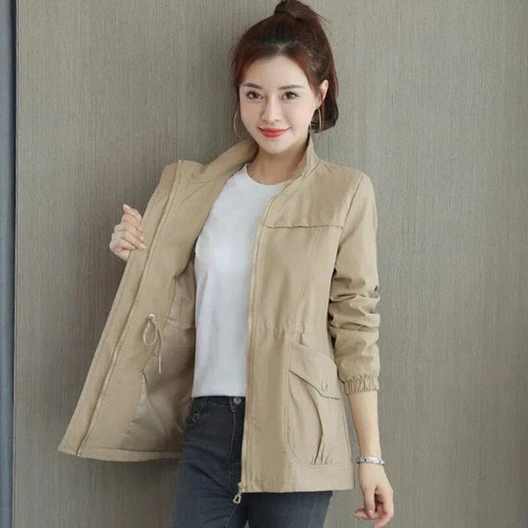 Woman wearing an open khaki cinched waist jacket