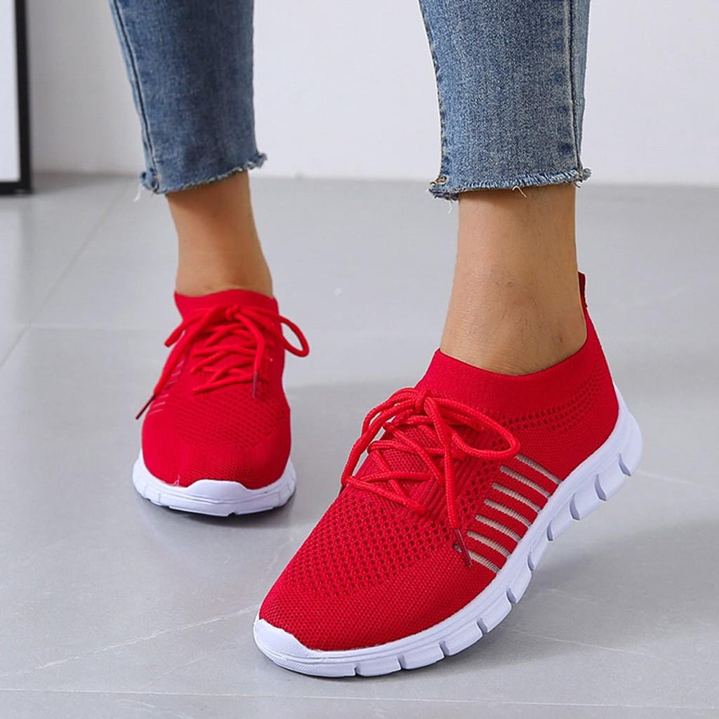 Woman wearing red lightweight knit sneakers