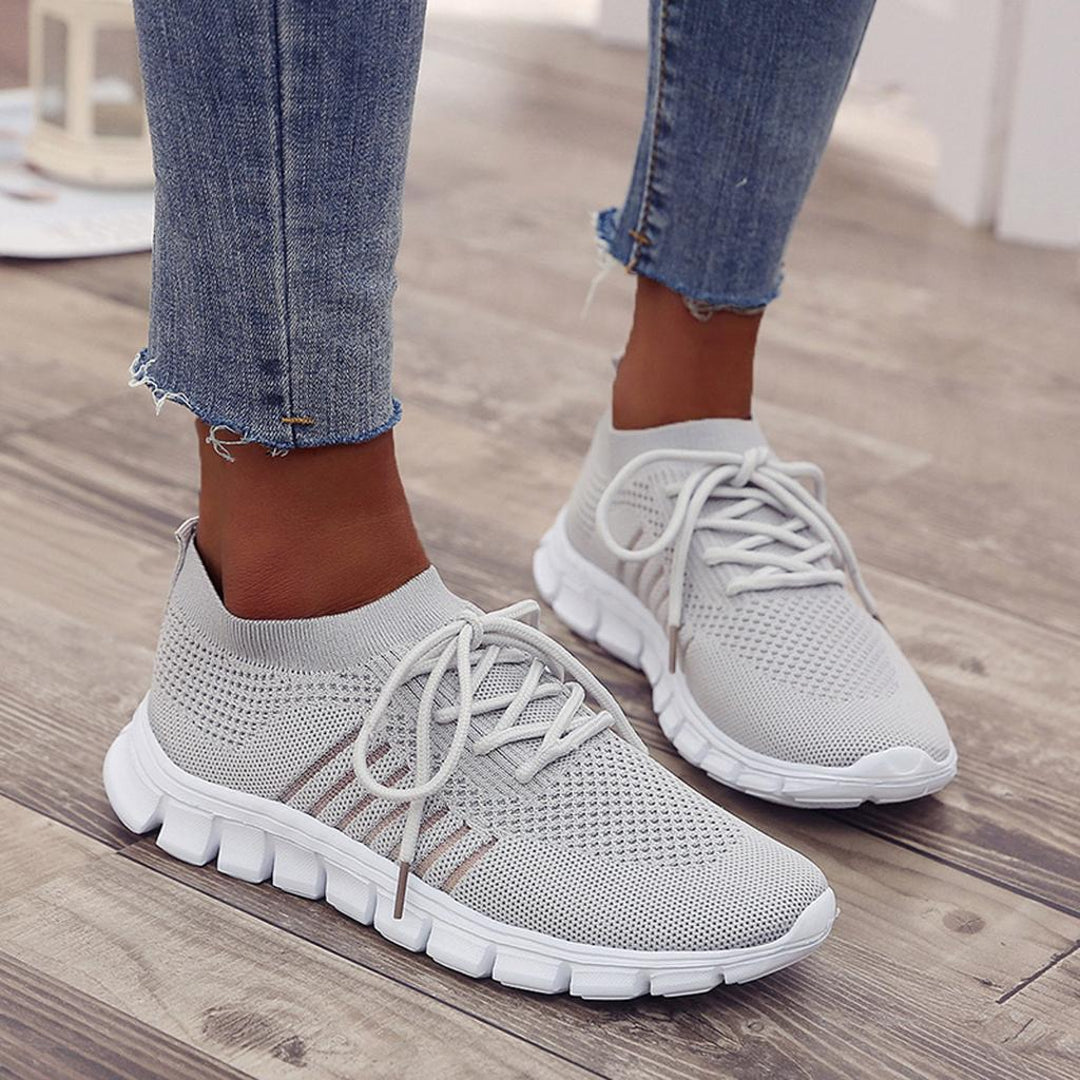 Woman wearing grey knit sneakers