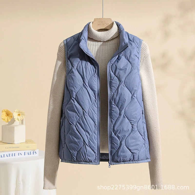 Women's lightweight quilted vest with stand collar in dusty blue