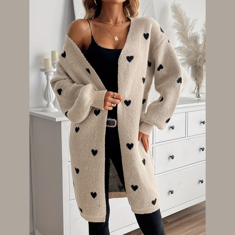 Woman wearing the beige heart pattern cardigan – close-up