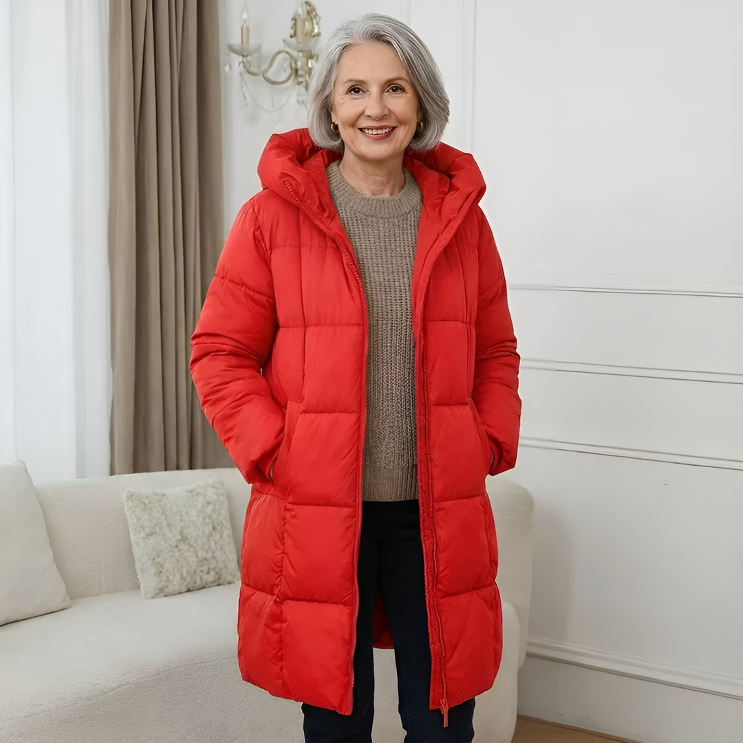 Woman wearing a red longline puffer coat with hood