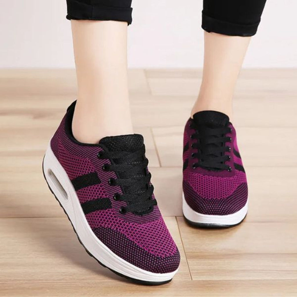 Purple sneakers with black side stripes – side view