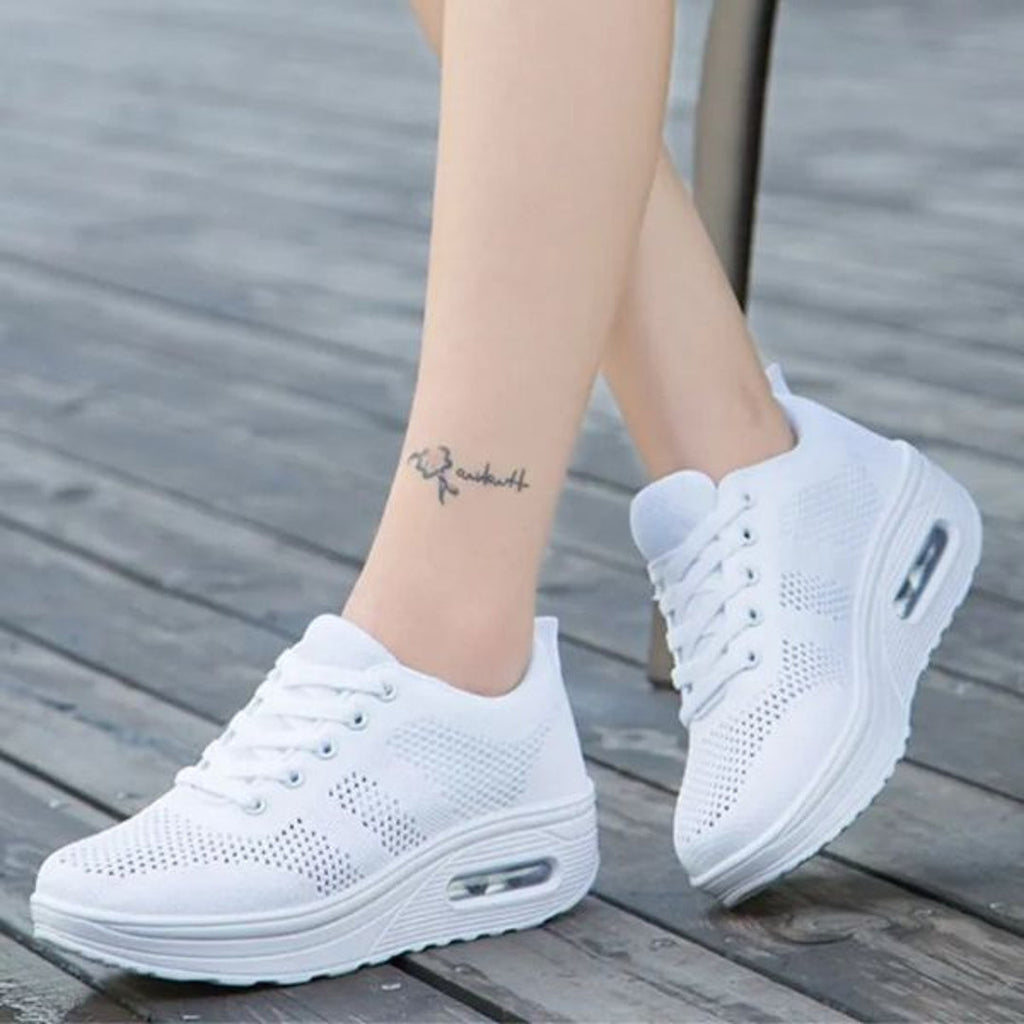 White sneakers with cushioned sole – side view