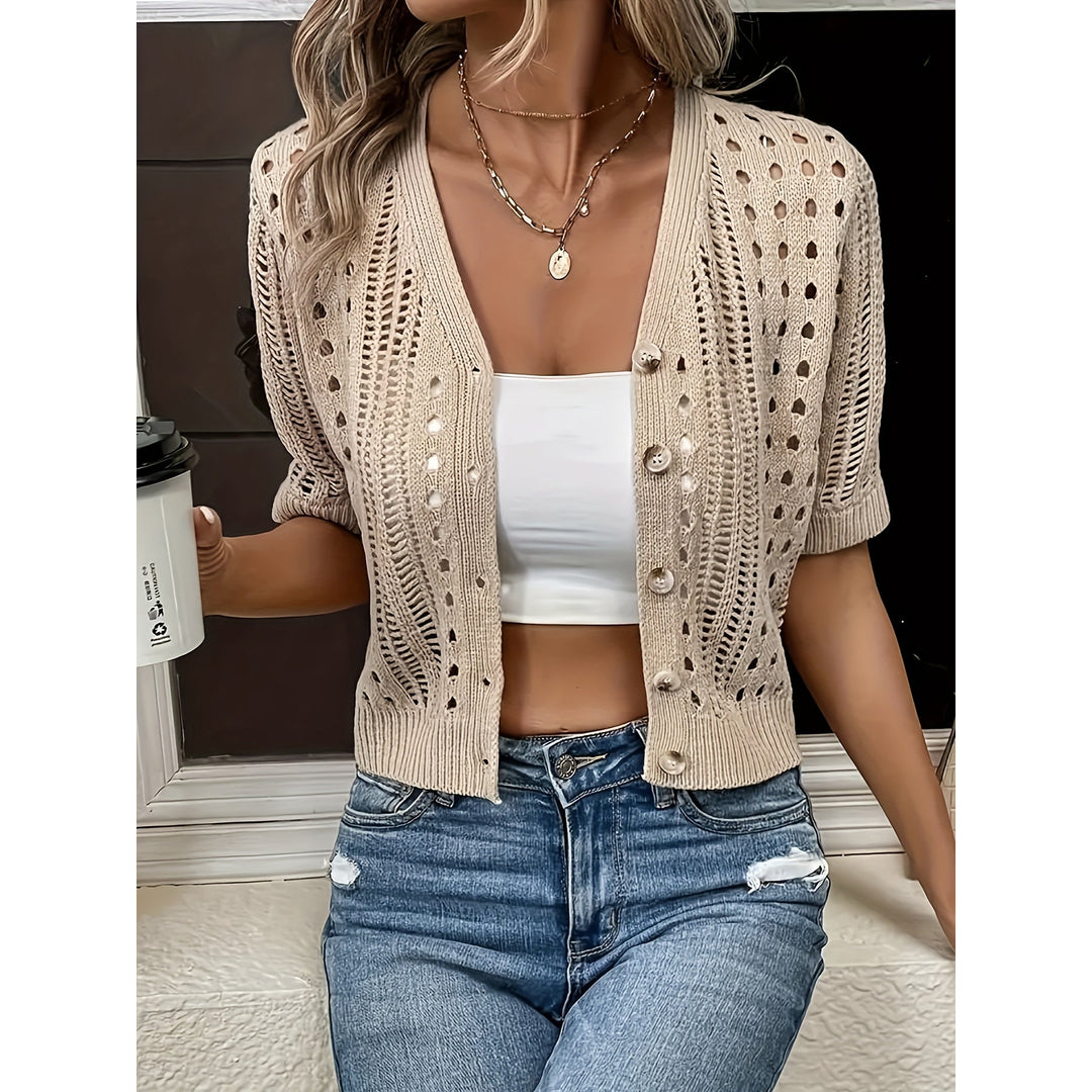 Woman wearing an apricot open-knit short sleeve cardigan