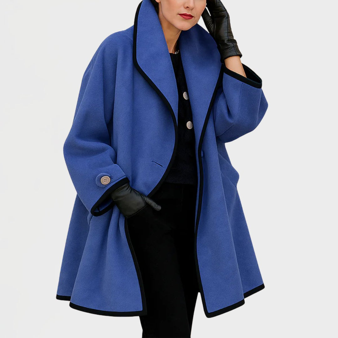 Woman wearing a blue oversized A-line coat