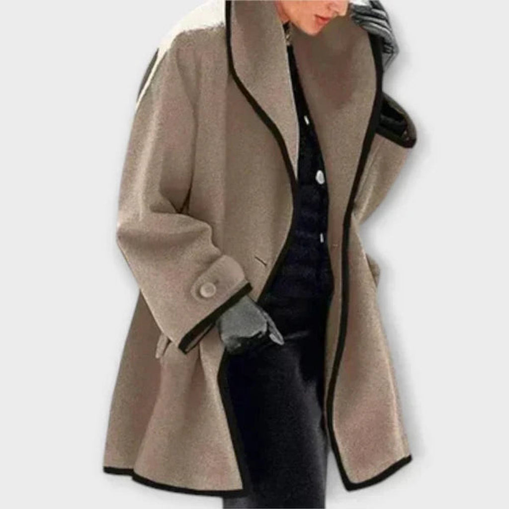 Woman wearing a khaki oversized coat with contrast trim