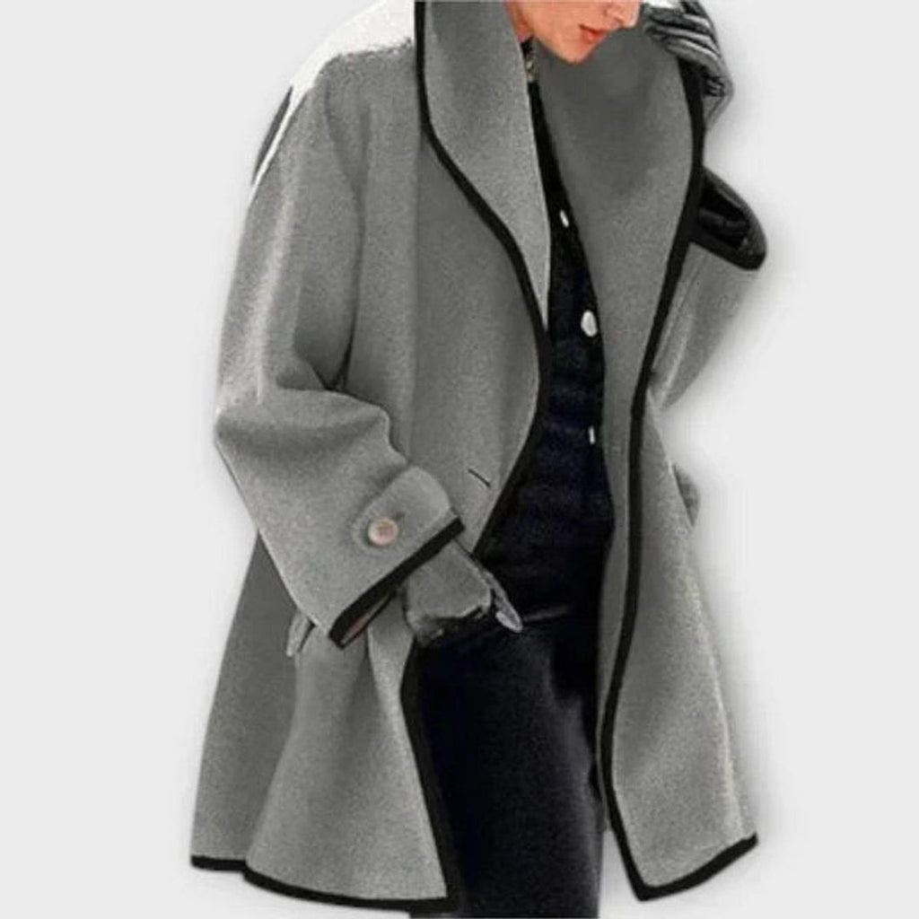 Woman wearing a grey A-line coat
