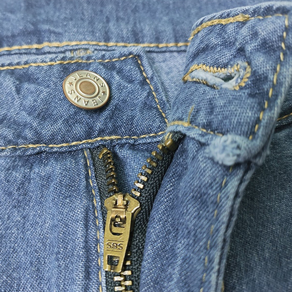Close-up of the button and zip fly on the wide-leg jeans