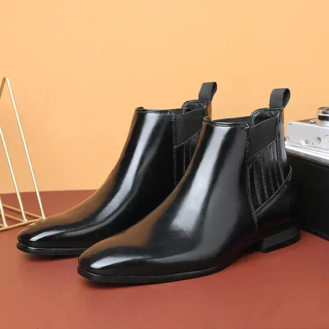 Pair of women's black pointed Chelsea boots