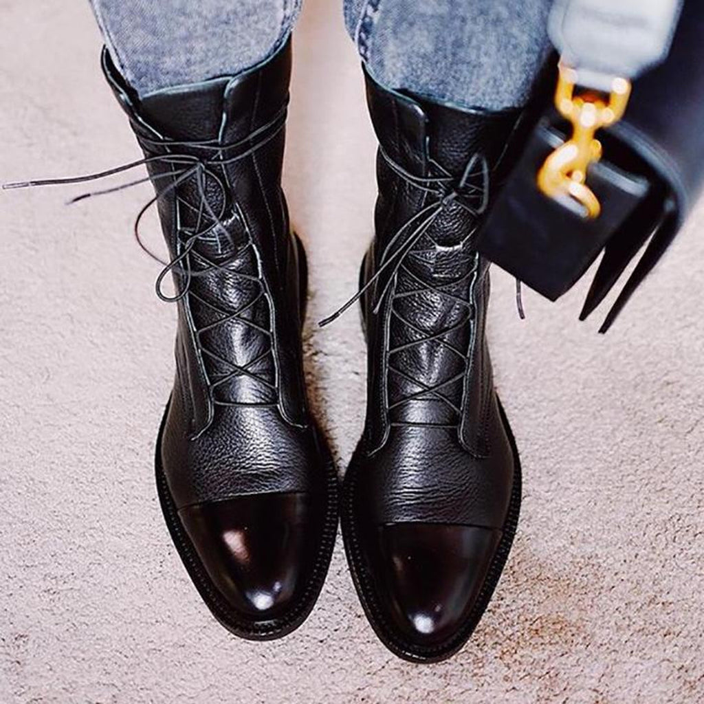 Black polished ankle boots with jeans