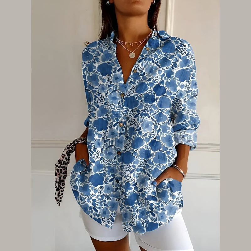 Woman wearing the blue floral shirt blouse – side view