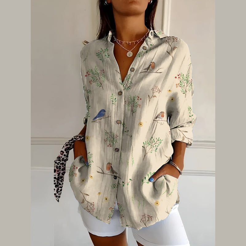 Woman wearing the beige print shirt blouse – side view