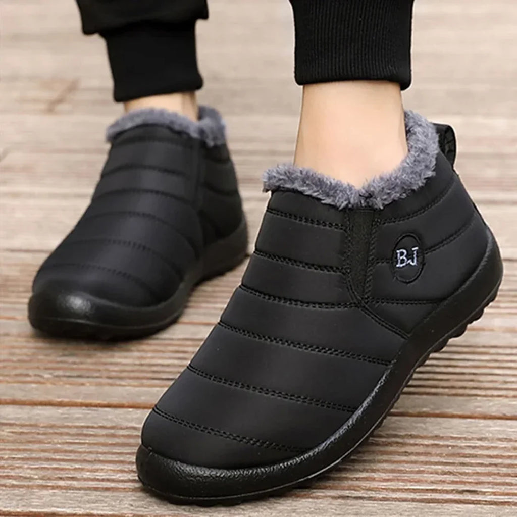 Woman wearing black quilted ankle boots