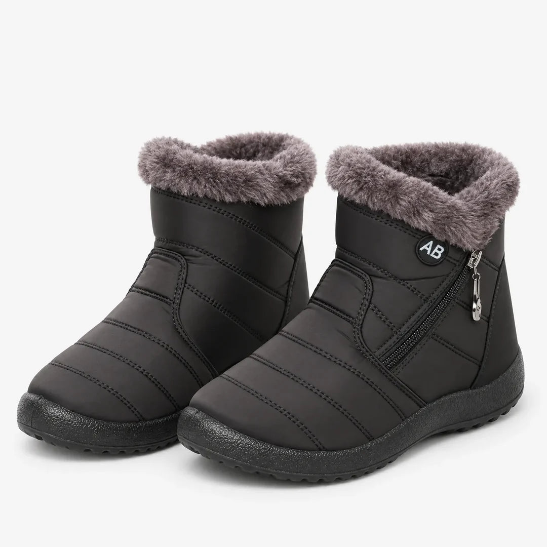 Pair of women's black quilted winter ankle boots