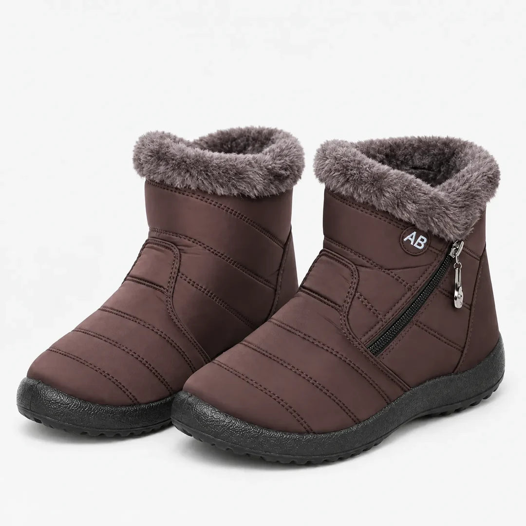 Pair of women's brown quilted winter ankle boots