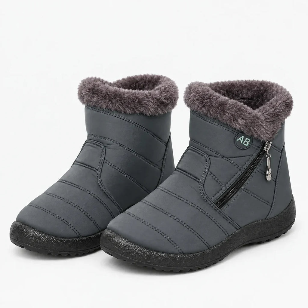 Pair of women's grey quilted winter ankle boots