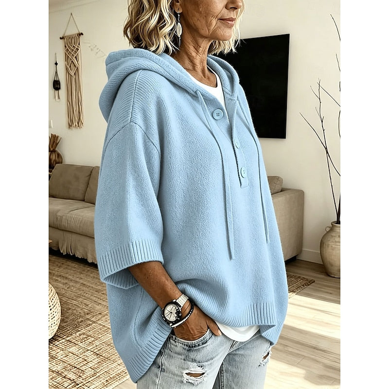 Woman wearing the sky blue hooded sweater – side view