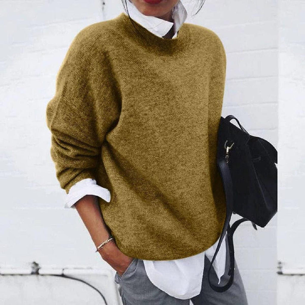 Woman wearing a khaki round neck knit sweater