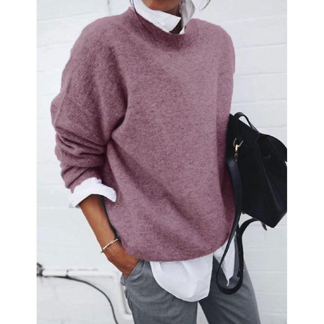 Woman wearing a pink relaxed round neck sweater