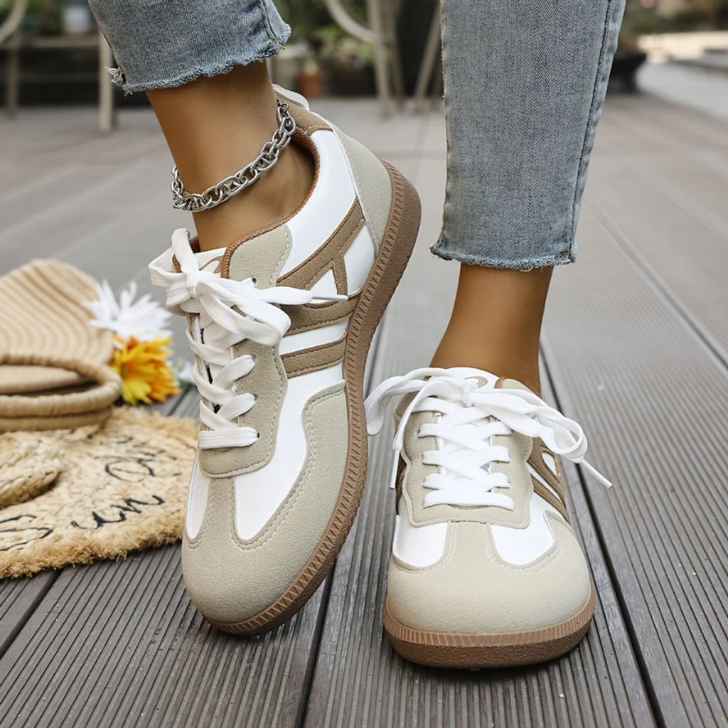 Women's retro contrast stripe sneakers in white taupe, worn
