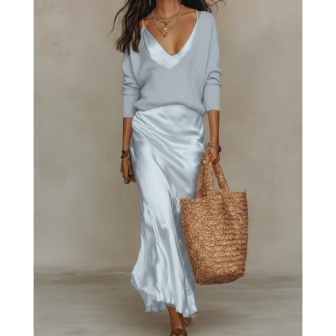 Woman wearing a light blue satin midi set