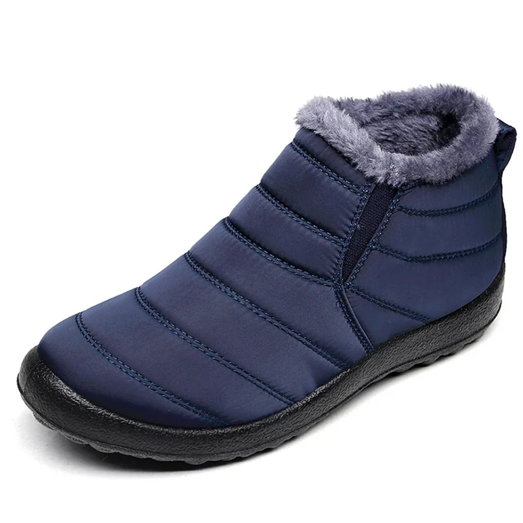 Women's navy quilted ankle boot with grey collar – side view