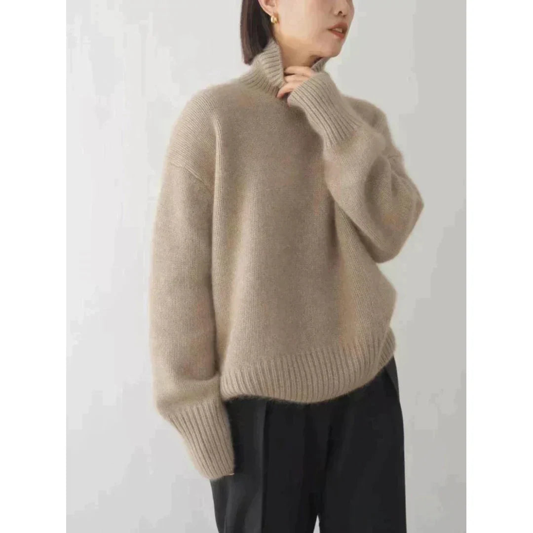 Woman wearing a khaki roll neck sweater