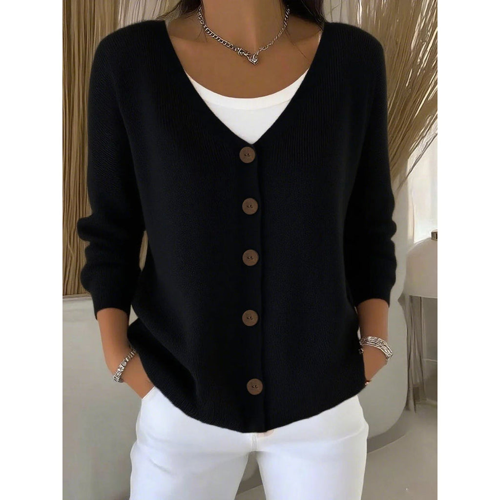 Woman wearing a black knit button cardigan