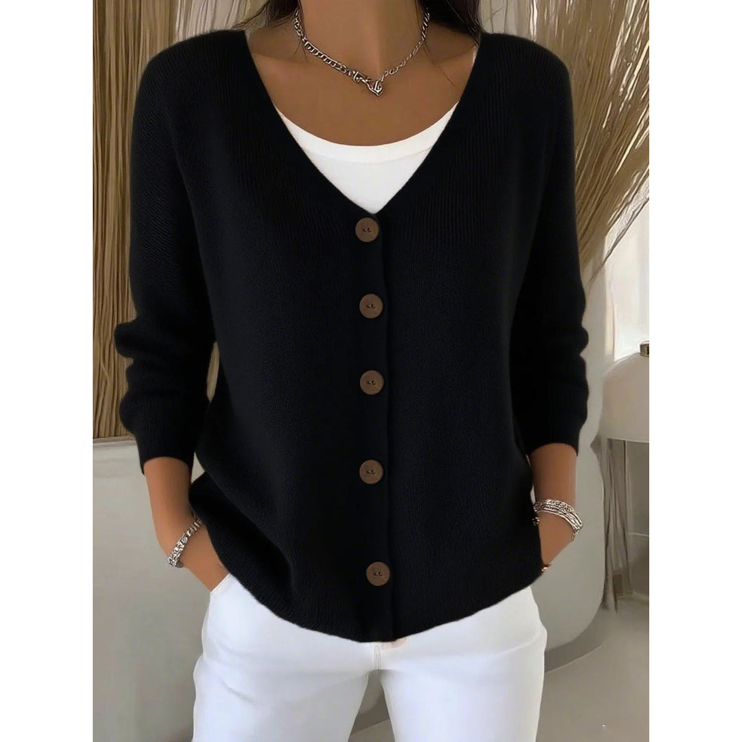 Woman wearing a black knit button cardigan