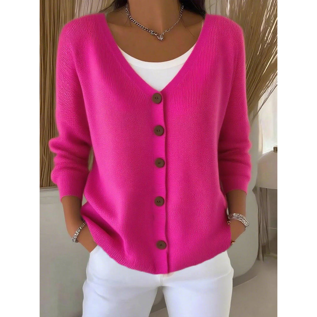 Woman wearing a hot pink button cardigan