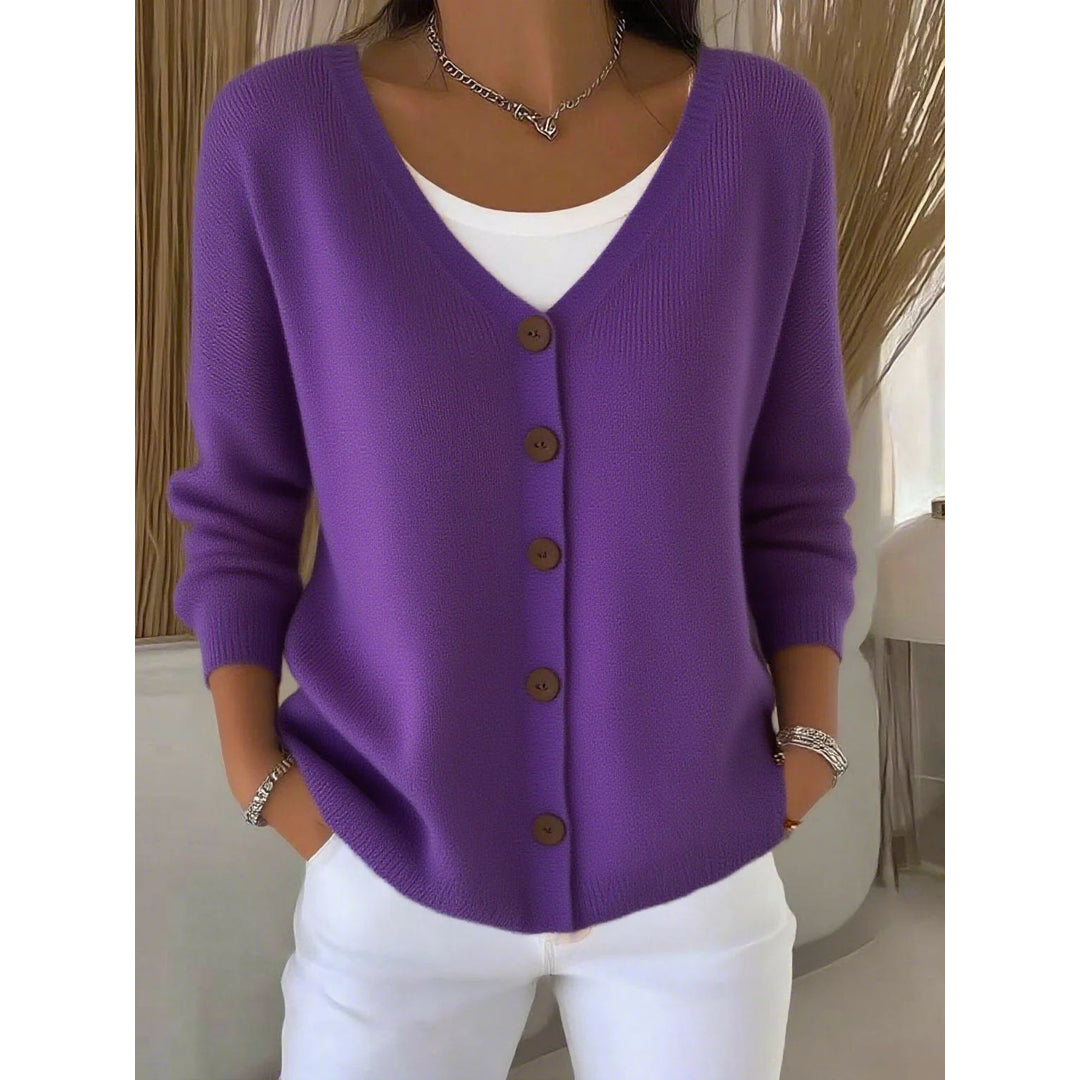 Woman wearing a purple V-neck knit cardigan